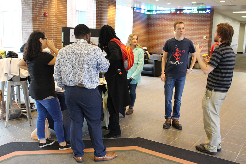 CEO selling donuts to students