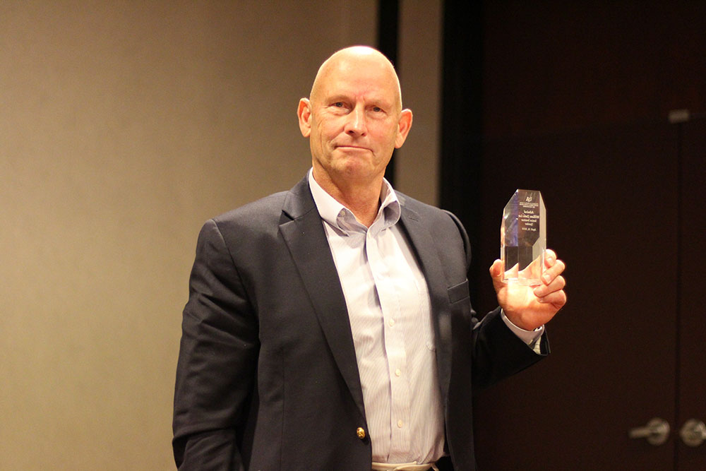 Admiral Dean Lee with college award