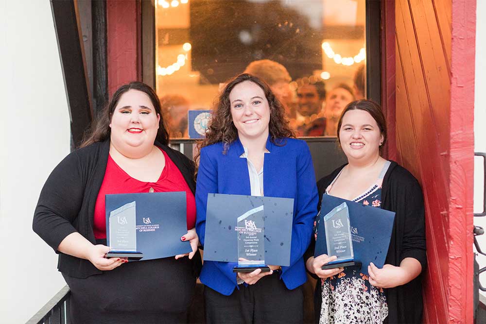 The competition winners posing with their awards.