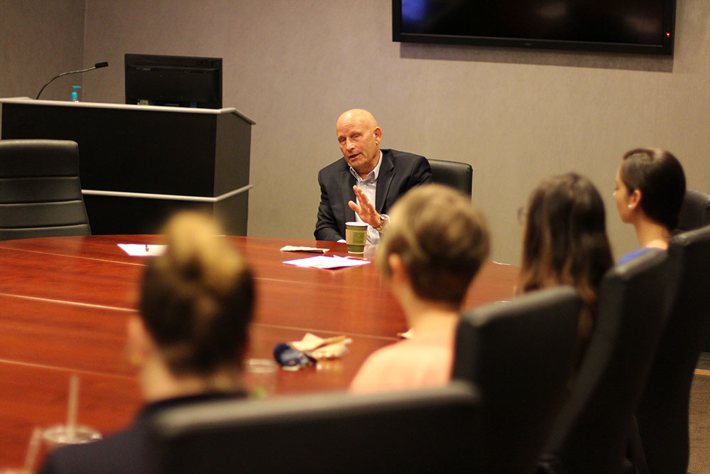 Admiral Dean Lee speaking to scholars and ambassadors