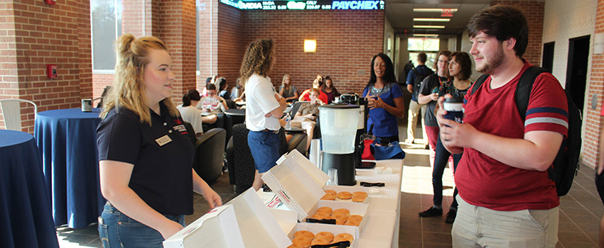 MCOB Students getting dougnuts