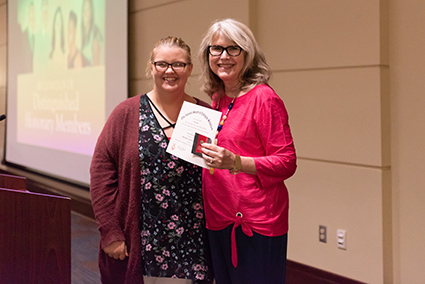 Dr. Maes accepting award