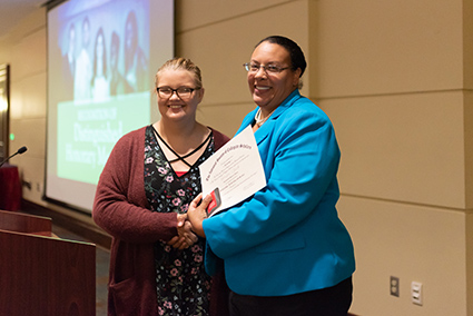 Dr. Cole accepting award