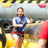 Female student running on obstacle course