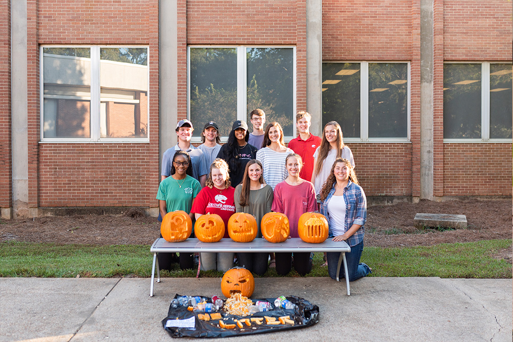 Mitchell Ambassadors with their carved pumpkins.