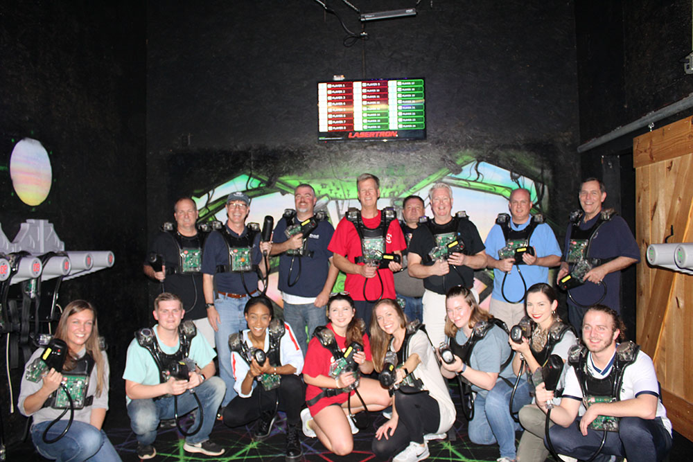 Mitchell Ambassadors playing laser tag with faculty
