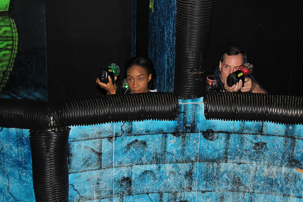 Mitchell Ambassadors playing laser tag with faculty