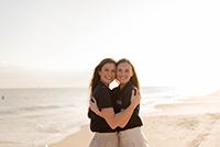 Two female ambassadors hugging