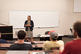 Speaker in front of class for Women in Business