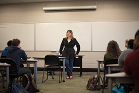 Speaker in front of class for Women in Business