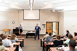 Man giving a presentation in front of class