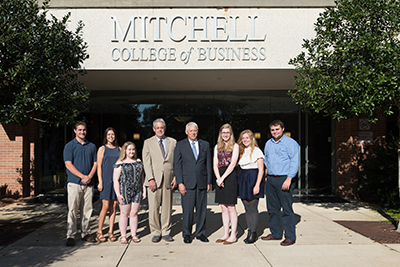 Dr. Waldrop with the scholars outside of MCOB