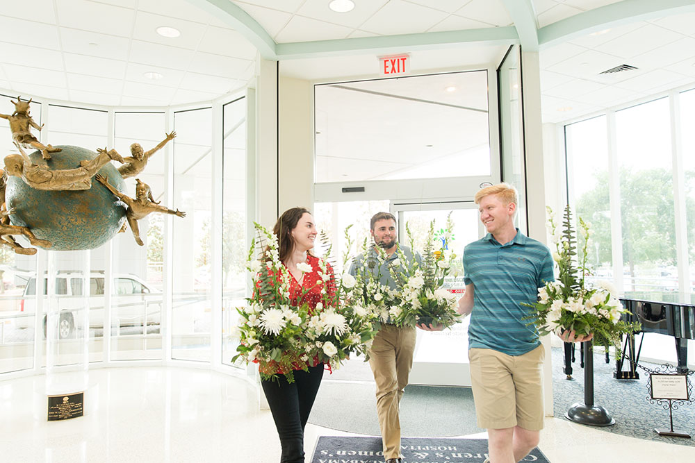 Students donating flowers to local hospital