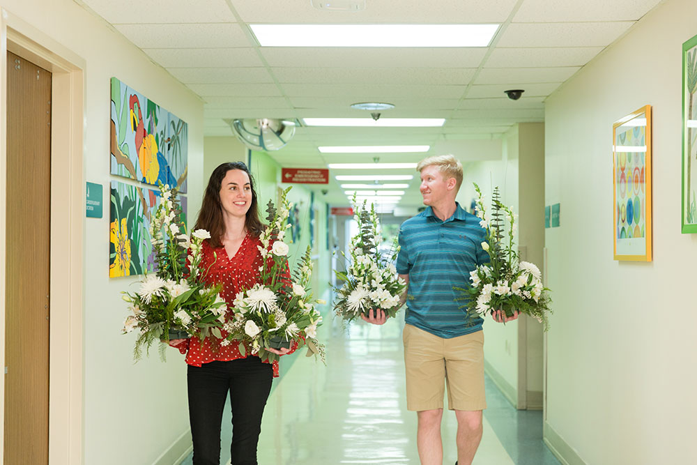 Students donating flowers to local hospital