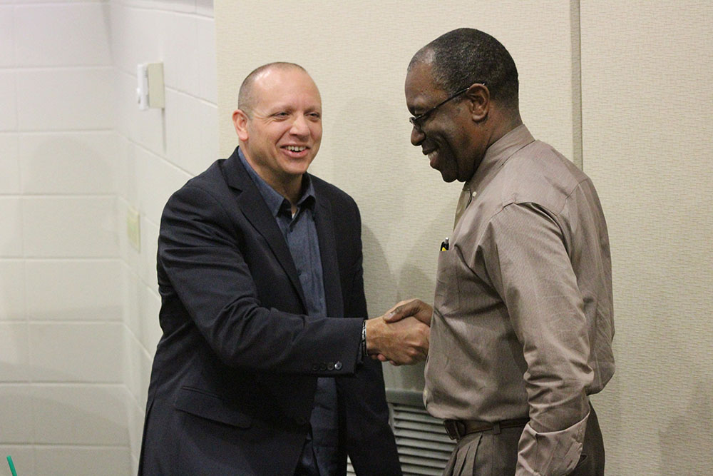 John Terzo shaking hands with Dr. Williams