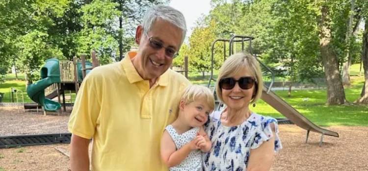 Dr. Bob Wood with his wife Terri and Grandson.