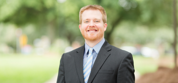 Dr. Matt Howard standing out side on campus.