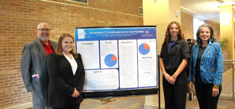 Our two MCOB Students pictured with two of our MCOB professors alongside one of their research projects. (From left to right, Dr. Al Chow, Cheyenne Jackson, Angelina Ladner and Jennifer Zoghby.