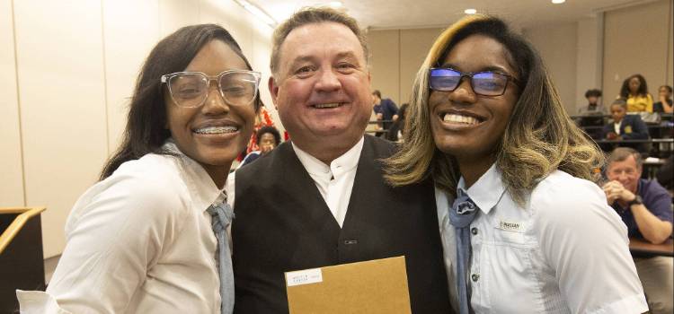 Dr. Thomas Nelson pictured with two winners of the Spark pitch competition for their business NYSKI Threads. - Nyla Burley and Princess Powe.