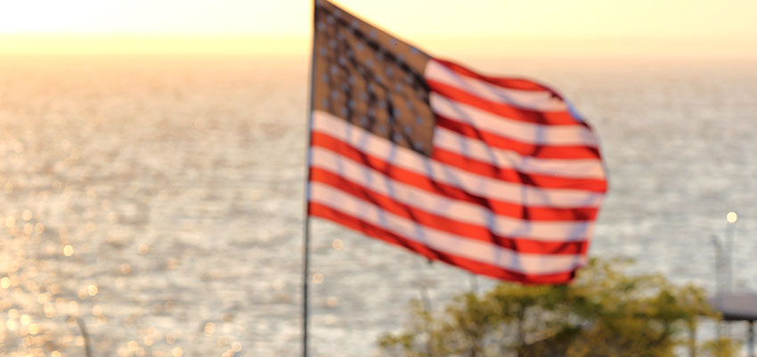 American Flag in front of Mobile Bay.