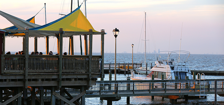 Pier on Mobile Bay with boat data-lightbox='featured'