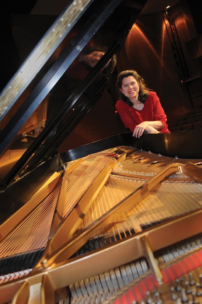 view from above with Elizabeth Moak seated at grand piano