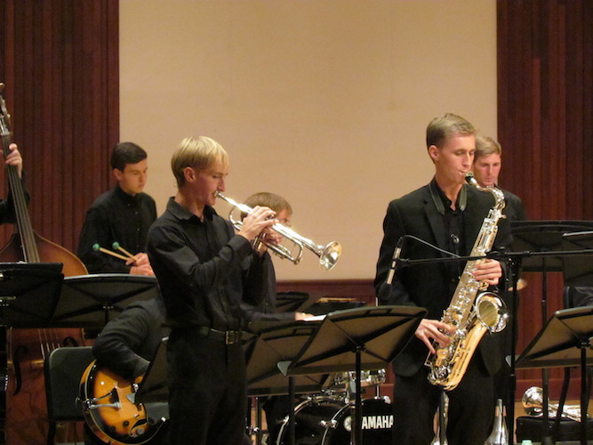 four members of USA Jazz Ensemble performing on stage