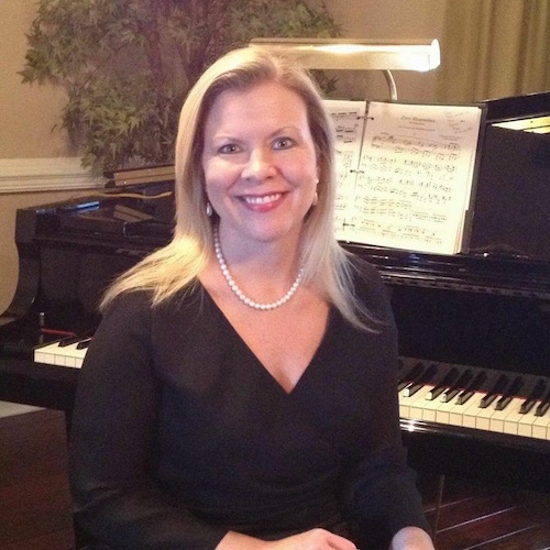 Tracy Mank seated in at piano