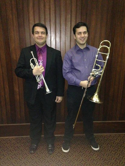 Trombonist Will Rosati and trumpeter James Rogers posed with their brass instruments