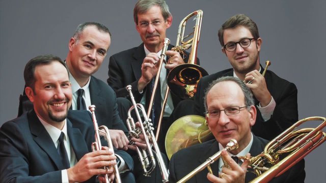 Members of American Brass Quintet posing with their instruments