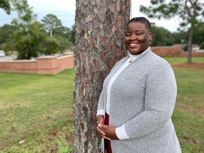 Pictured outside the Laidlaw Performing Arts Center is soprano Asia Smith. data-lightbox='featured'