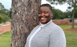 Pictured outside the Laidlaw Performing Arts Center is soprano Asia Smith.