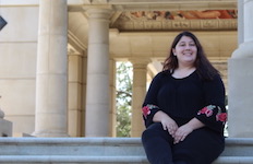 Flutist Rebecca Bates poses outside on the campus of South Alabama.