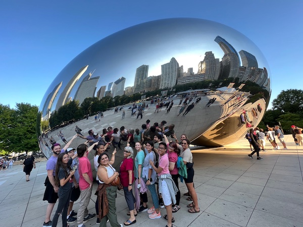 Members of USA Celtic Crúe are pictured as a group posing in front of Chicago's famous "Bean" mirror sculpture. data-lightbox='featured'