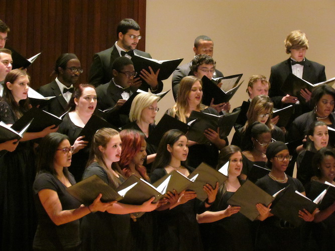 close-up on a members of USA Concert Choir as they perform