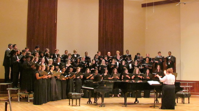 Pictured is the USA Concert Choir performing on the stage of the Laidlaw Performing Arts Center Recital Hall.