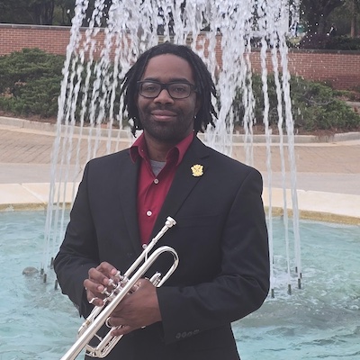 Pictured standing by the Laidlaw Performing Arts Center fountain is trumpeter Jaleel Hughes. data-lightbox='featured'