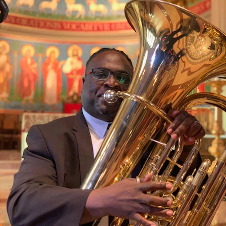 Pictured playing the tuba is USA faculty tubist Dr. Clayton Maddox. data-lightbox='featured'