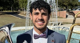 Pictured holding both the trombone and euphonium is senior low brass performer Juan Carlos Mata.