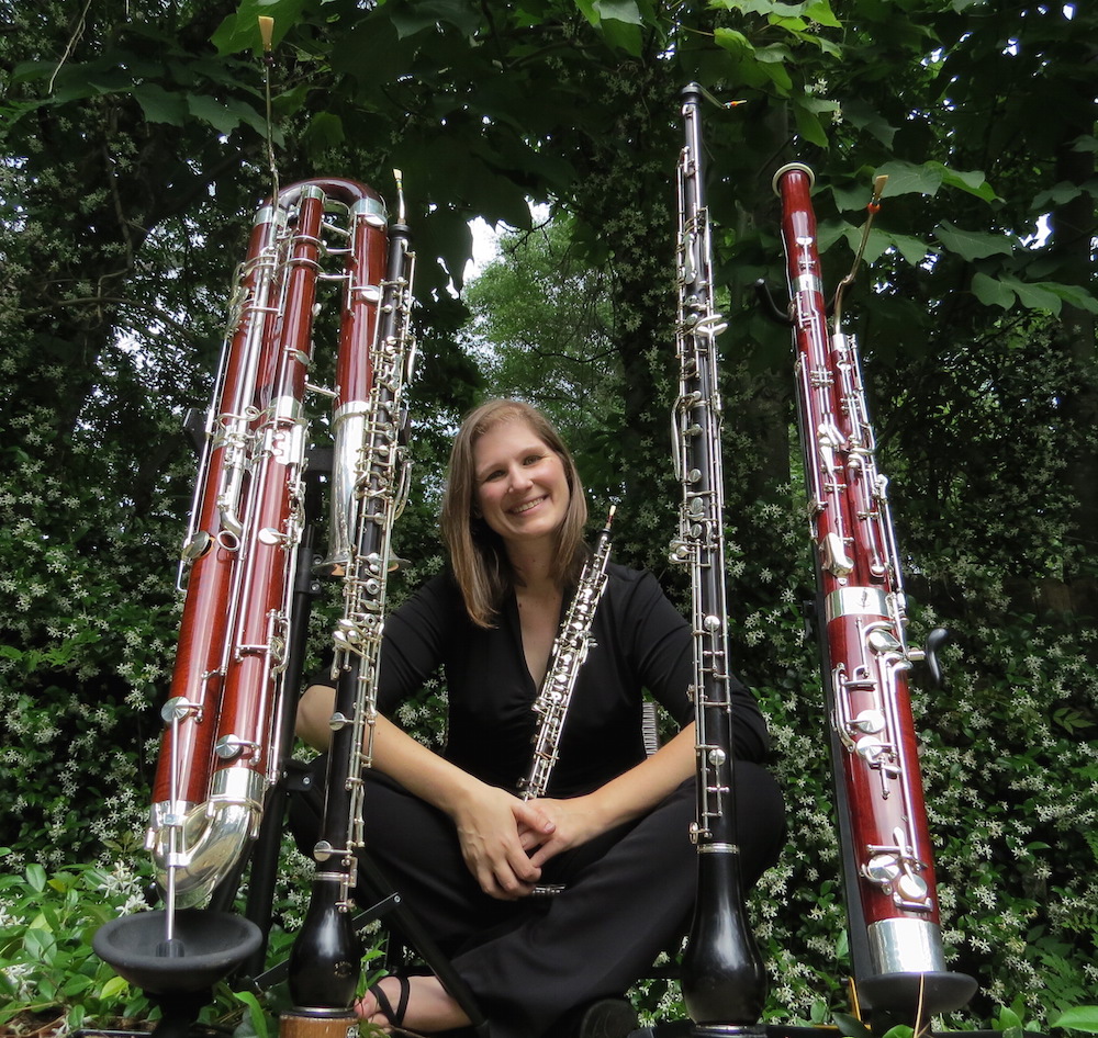 Rebecca Mindock Faculty surrounded by Double Reed instruments data-lightbox='featured'