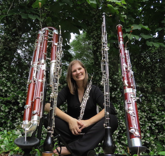 Dr. Rebecca Mindock seated and surrounded by instruments