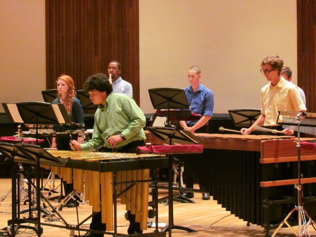 members of USA Percussion Ensemble performing on stage