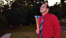 Pictured at sunset outside of the Laidlaw Performing Arts Center is percussionist Trevor Perez.