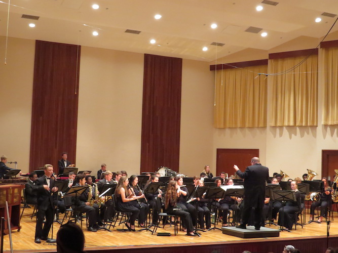 Pictured on stage in the Laidlaw Performing Arts Center Recital Hall is the USA Symphony Band.