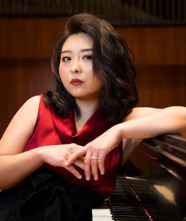 Pictured at the piano is Dr. Lucy Tan. data-lightbox='featured'