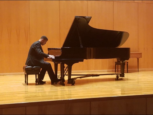 Pictured in performance is graduate pianist Daniel Thomas. data-lightbox='featured'