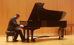 Pictured on stage performing on the grand piano is Daniel Thomas.