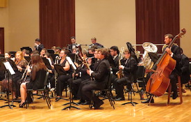 Pictured in performance is the USA Wind Ensemble.