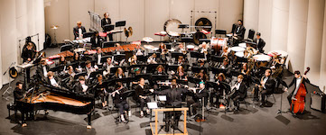 Pictured on the Saenger Theatre stage is the USA Wind Ensemble in a previous performance.