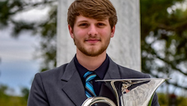 Pictured outdoors on the USA campus is euphoniumist Christopher Wren.